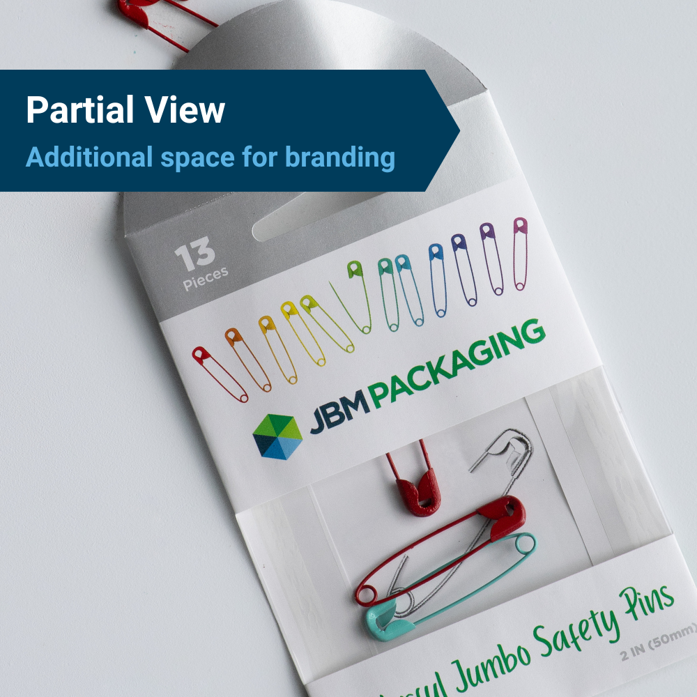 JBM-branded partial view windowed packaging used for safety pins, under the heading, "Partial View: Additional Space for branding."
